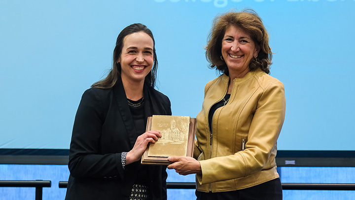 From left, Corinne Gressang, assistant professor of history, is presented the 2026 President’s Award for Excellence in Teaching (Tenure Track) by SRU President Karen Riley.