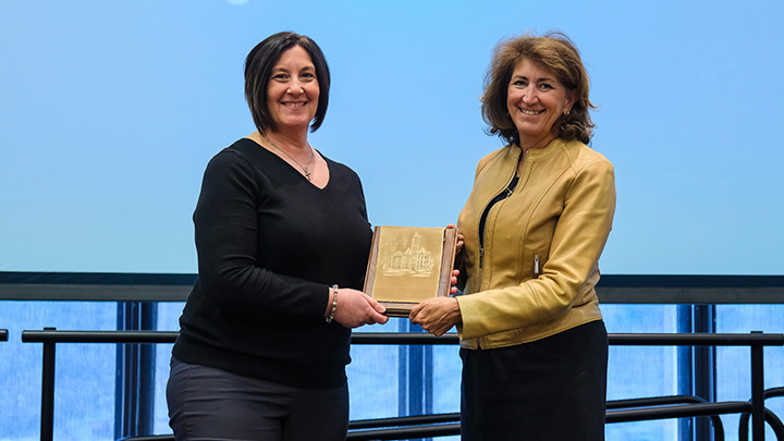 From left, Beth Larouere, associate professor of exercise science, is presented the 2026 President’s Award for Advising Excellence (Established Category) by SRU President Karen Riley.