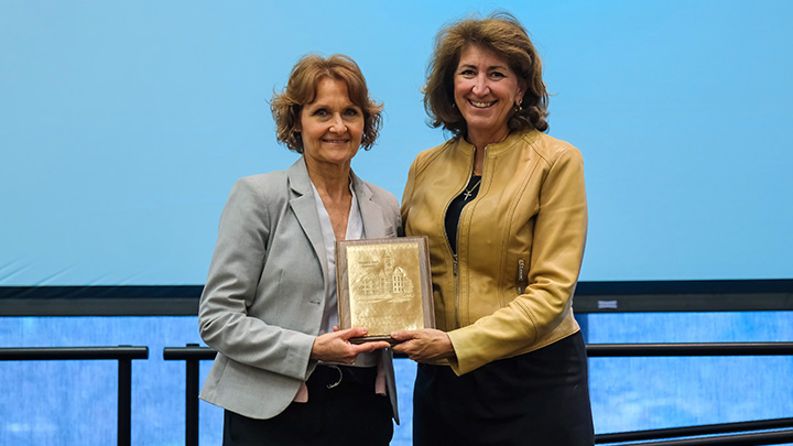 From left, Lu Ann Znosko, administrative assistant of Academic Affairs, is presented the 2026 President’s Award for Outstanding Service by SRU President Karen Riley.