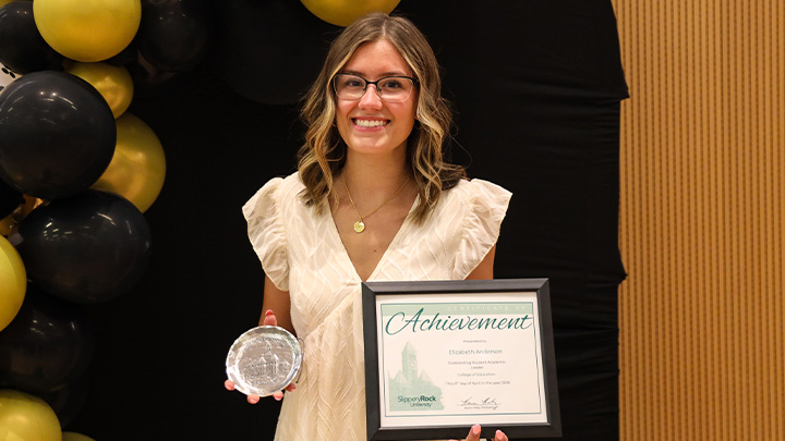 Elizabeth Anderson, a senior mid-level math education major from Sewickley (Avonworth HS), accepts the College of Education’s Outstanding Student Academic Leader award.