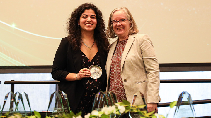 From left, Martina Tatalias, a junior mechanical engineering major from Bethel Park (Bethel Park HS), is awarded the College of Engineering and Science’s Outstanding Student Academic Leader award from Dean Nicole Dafoe.