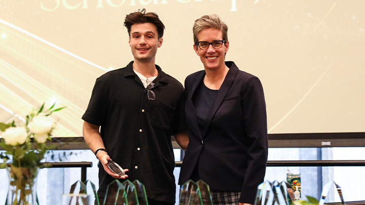 From left, Matthew Deemer, a senior exercise science major from Zelienople (Seneca Valley HS), is awarded the College of Health Professions’ Outstanding Student in Research, Scholarship or Creative Activity award from Dean Christina Karshin.