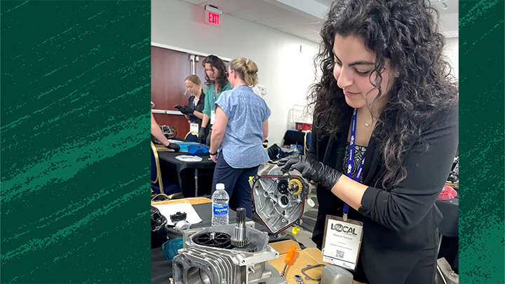 Martina Tatalias works with a lawn mower engine during a workshop at a Society of Women Engineers conference. As president of the SWE chapter at SRU, Tatalias helps connect women engineering students to opportunities that include hands-on activities and networking with industry professionals.