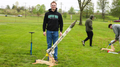 Jacob Cerra, a junior mechanical engineering major, displays his water rocket during a launch demonstration on campus as part of a Thermal System Design class at SRU.