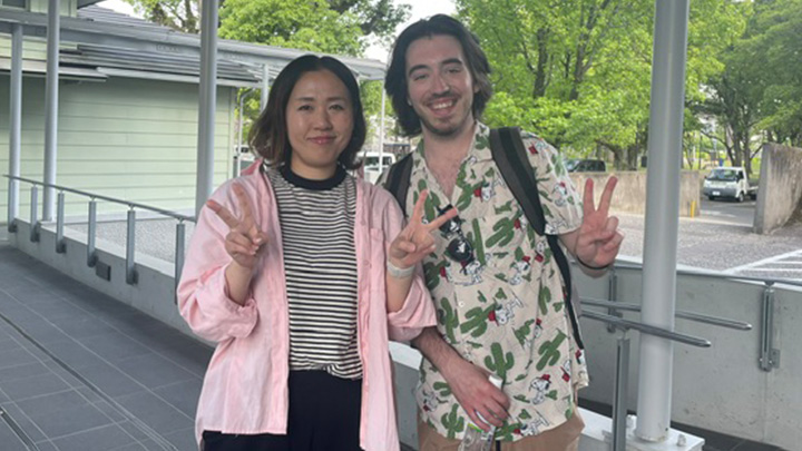 Host mother and SRU student posing while making peace signs.