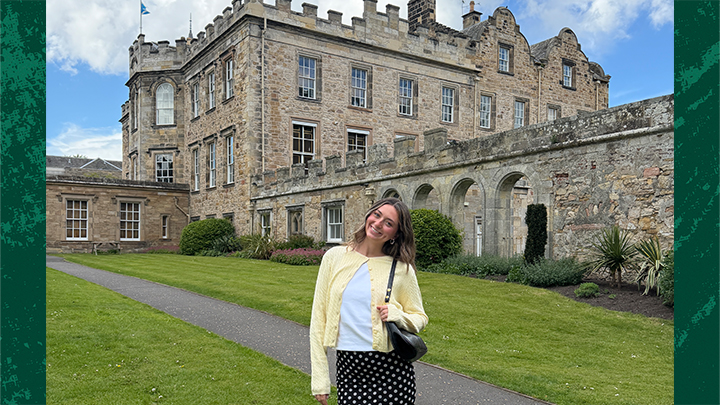 Woman standing in front of castle