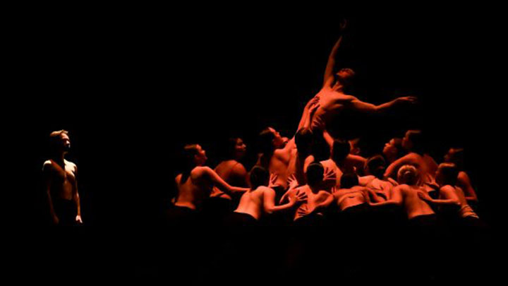 Dancers performing on stage.