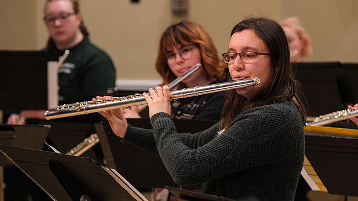 Students playing flutes.