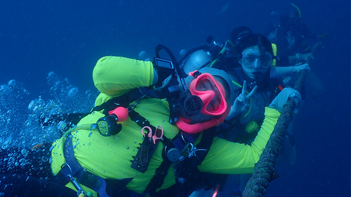 Two underwater scuba divers.