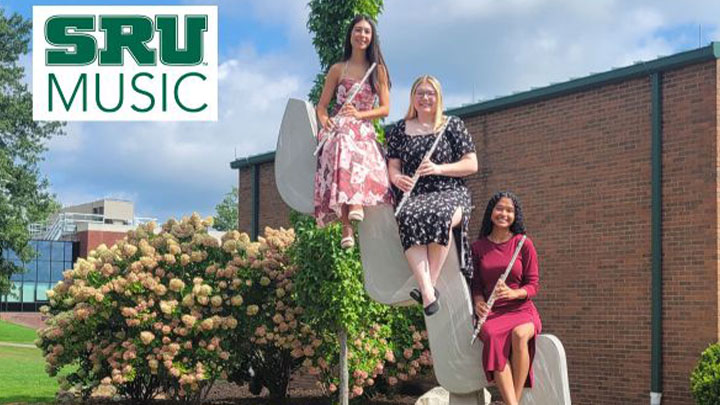 Three students posed with flutes.