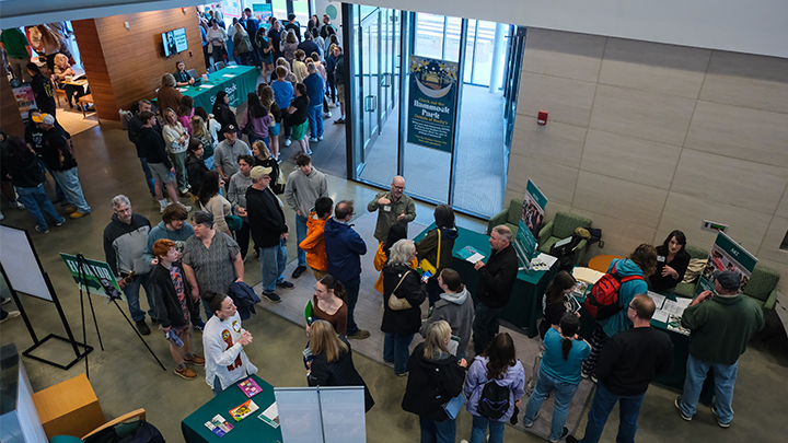 Overhead view of crowd in Smith Student Center lobby with tables and booths.